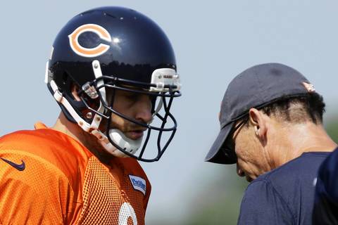 Bears quarterback Jay Cutler chats with coach Marc Trestman.