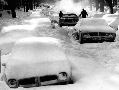 Cars are stuck in the roadway and covered with snow on Springfield Street at Augusta Blvd. after a major blizzard hit Chicago in January 1979.