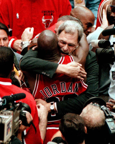 Chicago Bulls coach Phil Jackson hoists the NBA championship