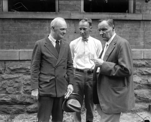 Well-known attorneys Dudley Field Malone, left, and Clarence Darrow, right, flank the defendant, John Scopes, in 1925 in Dayton, Tenn.
