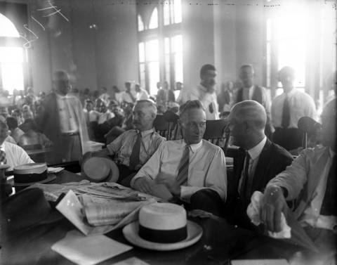 John Scopes is seated next to his father, Thomas Scopes, at the Rhea County Courtroom in July 1925.