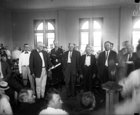 The jury reads a guilty verdict against John Scopes on July 21, 1925. According to Tribune articles at the time, the jury was "made up chiefly of hardshell Baptists and Southern Methodist farmers of middle age who have extremely hazy ideas about evolution but very firm beliefs as to the validity of the Bible in all things." It took the jury all of nine minutes to find the defendant guilty.