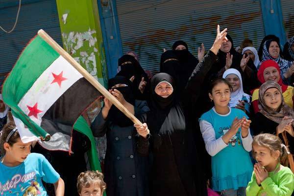 Anti-government protesters demonstrate in Syria