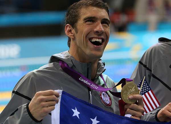 U.S. swimmer Michael Phelps holds his 19th Olympic medal, a gold he earned with teammates in the men's 4x200m freestyle relay. Phelps now has the the most medals in Olympic history.