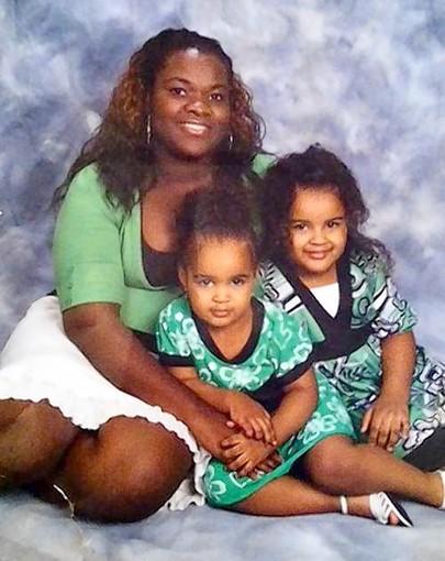 Carlene Pierre, who authorities say was shot and killed by her estranged boyfriend on Sept. 27, 2012, pictured with her two oldest children.