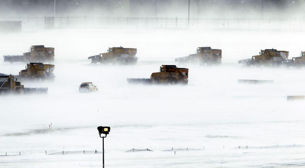 Crews work to clear runways at Philadelphia International Airport.  The December 2010 blizzard brought 12 to 32 inches of snow from northern Florida to Maine.