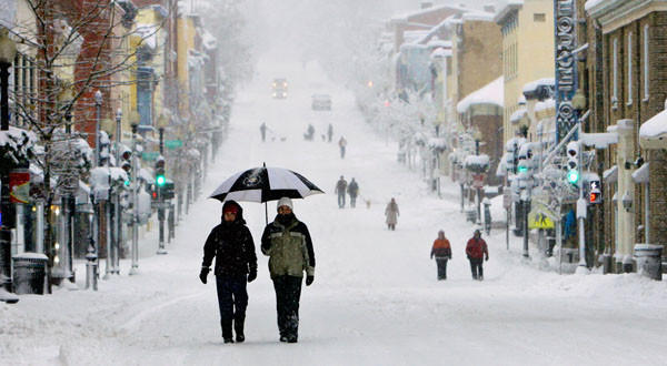 Pedestrians walk along Wisconsin Avenue in Washington. Together, two major storms of February 2010 were dubbed by some media as "Snowtorious B.I.G."