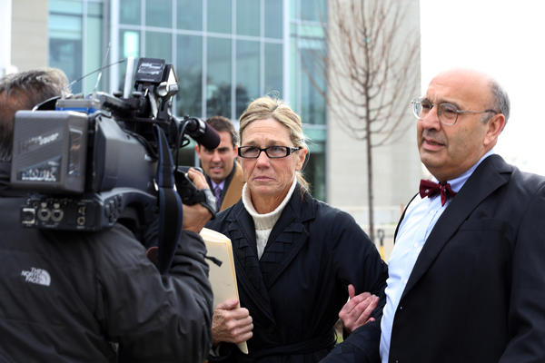 Rita Crundwell is led away by her attorney Paul Gaziano after pleading guilty in Federal Court.