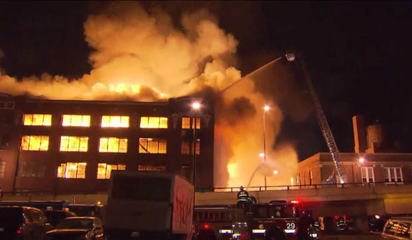 Firefighers battle an extra-alarm blaze in Bridgeport Tuesday night.