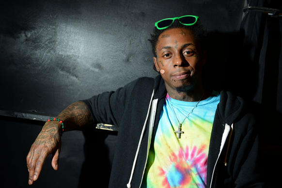 Rapper Lil Wayne has been visited by friends Nicki Minaj and Drake while hospitalized following a series of seizures.