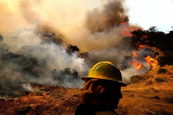 Firefighter battles a blaze in Monrovia.