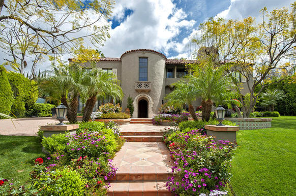 The 1920s house sits on more than three-quarters of an acre of manicured grounds.