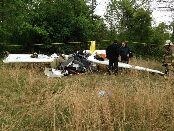 Authorities investigate the scene of a plane crash in Suffolk, Va., that killed Berry Raymond Newgent, 73, of Davidsonville and Thomas Berry Newgent, 51, of Westminster.