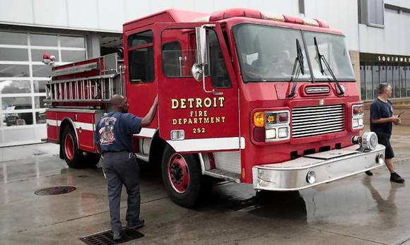 Detroit firefighters park ladder truck in front of southwest Detroit fire house in Detroit