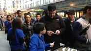Apple's new iPhones go on sale; fight breaks out at store