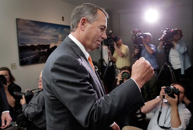 House Speaker John A. Boehner (R-Ohio) pumps his fist after leaving a meeting of House Republicans at the Capitol.
