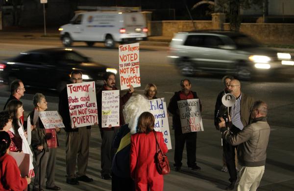 Parents and teachers protest outside the Valley Academy of Arts and Sciences in Granada Hills.