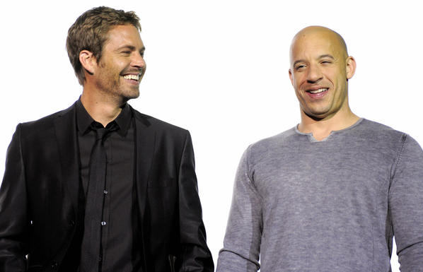 Vin Diesel (R) and Paul Walker pose during a photo call ahead of the European premiere of "Fast & Furious."