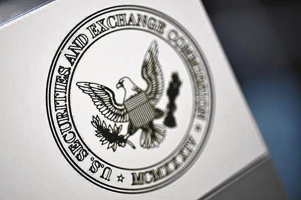 The U.S. Securities and Exchange Commission logo adorns an office door at the SEC headquarters in Washington, June 24, 2011.
