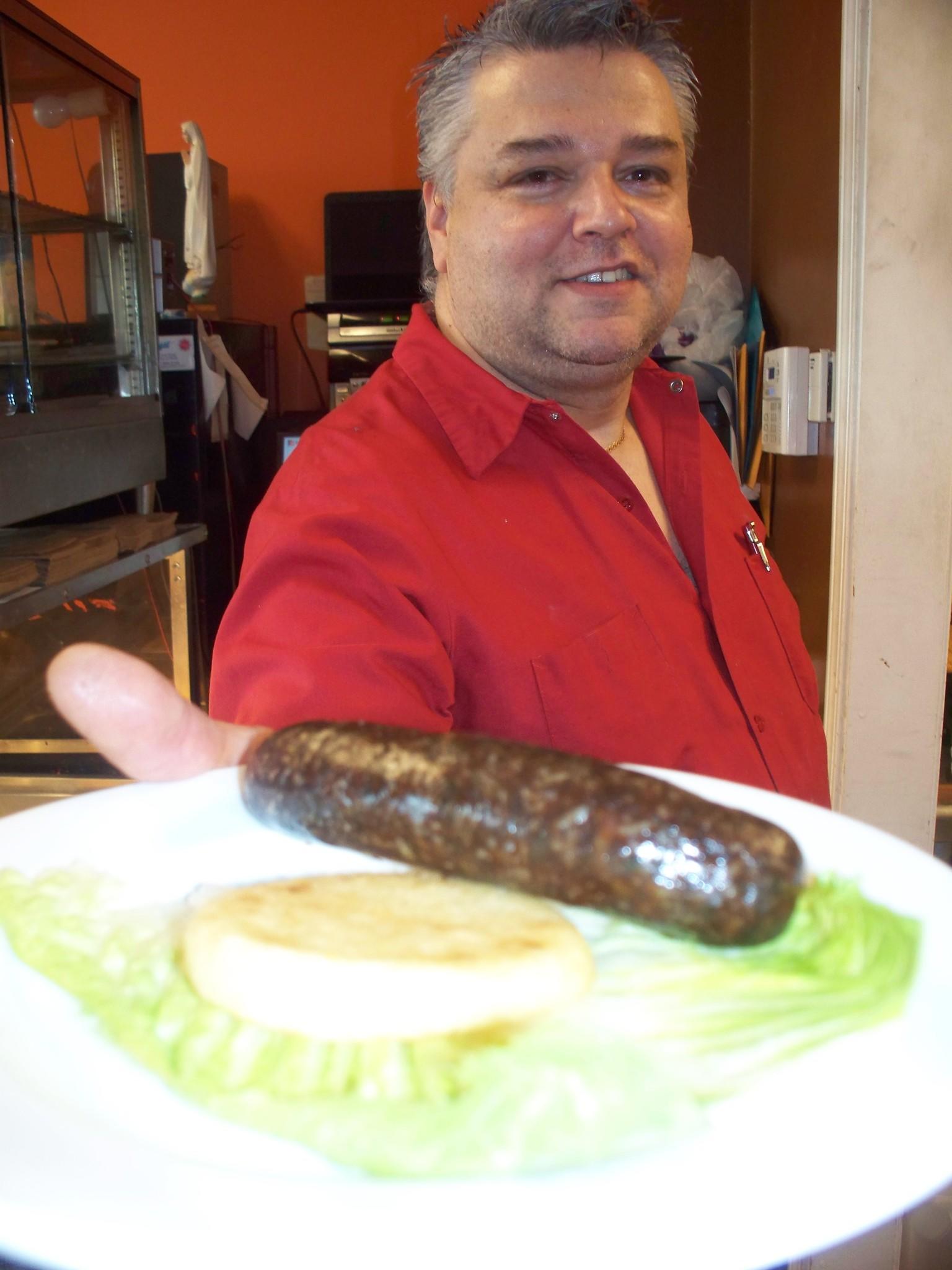 Colombian blood sausage can be found at Antojitos Donde Julio on Hartford's Park Street. Pictured is owner Julio Castano.