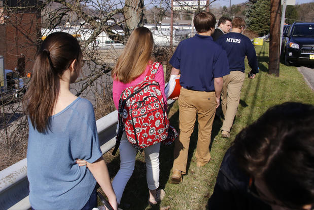 Students walk from the campus of Franklin Regional High School in Murrysville, Pa., after a mass stabbing left at least 20 people injured.