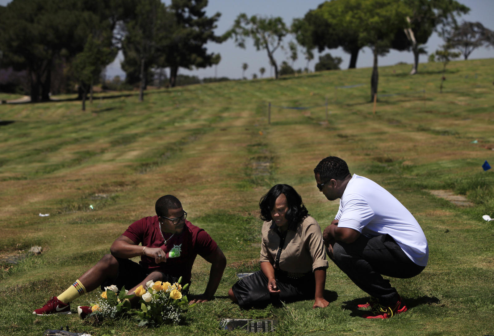 Atwan Williams, LaQuita Suggs and Solomon Ricks visit LaQuita mother's grave at the Inglewood Park Cemetery on the seventh anniversary of her death. LaQuita's mother Ella Suggs was stabbed multiple times and died April 29, 2007.