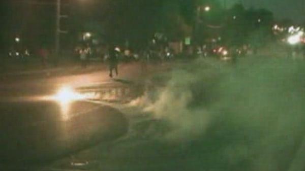 Video: Protesters in Ferguson run from tear gas