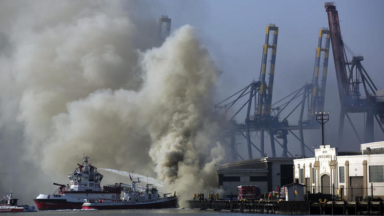 Fire crews work to contain Port of L.A. blaze