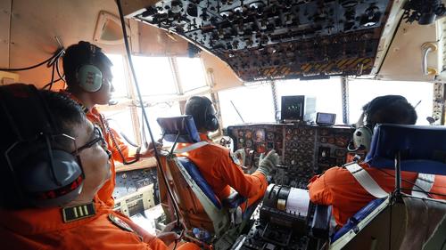 Search for missing AirAsia jetliner resumes in wider area - LA Times