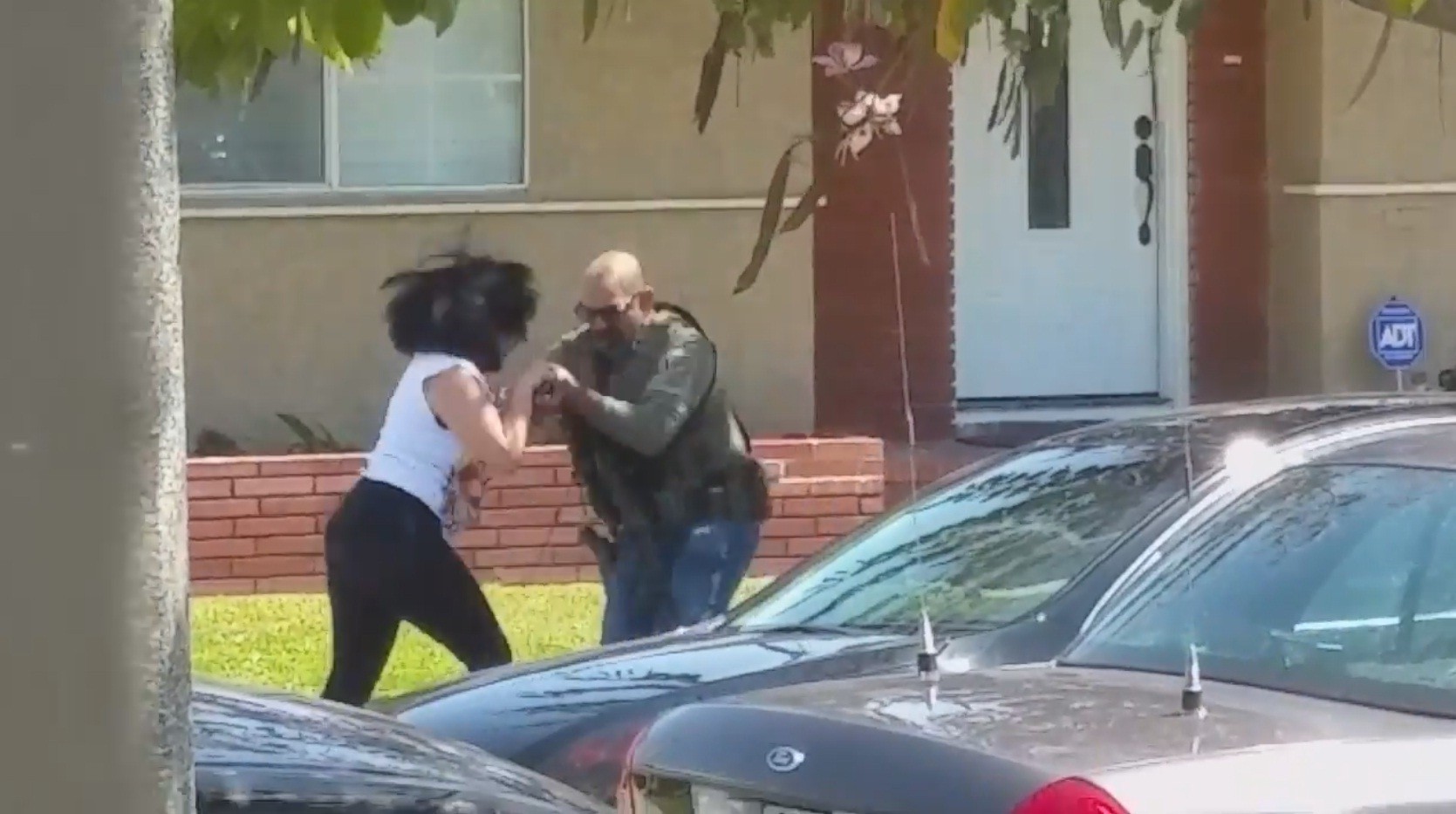 Feds probe video showing officer slamming woman's phone in South Gate