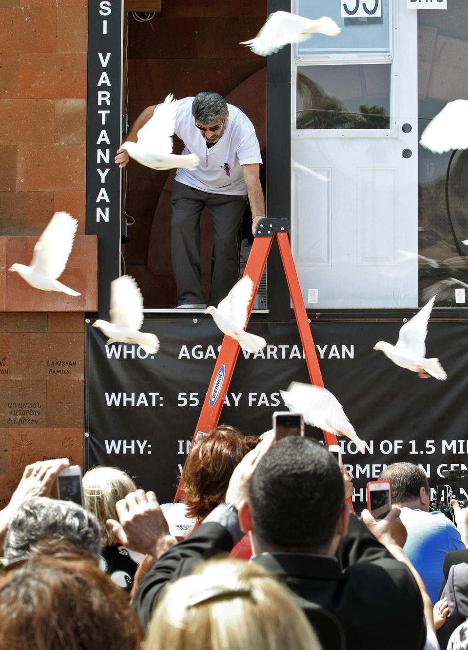 <p>Agasi Vartanyan emerges from a glass enclosure at St. Leon Cathedral in Burbank on Thursday, May 28, 2015, where he fasted for 55 days to commemorate the 100th anniversary of the Armenian Genocide.</p>