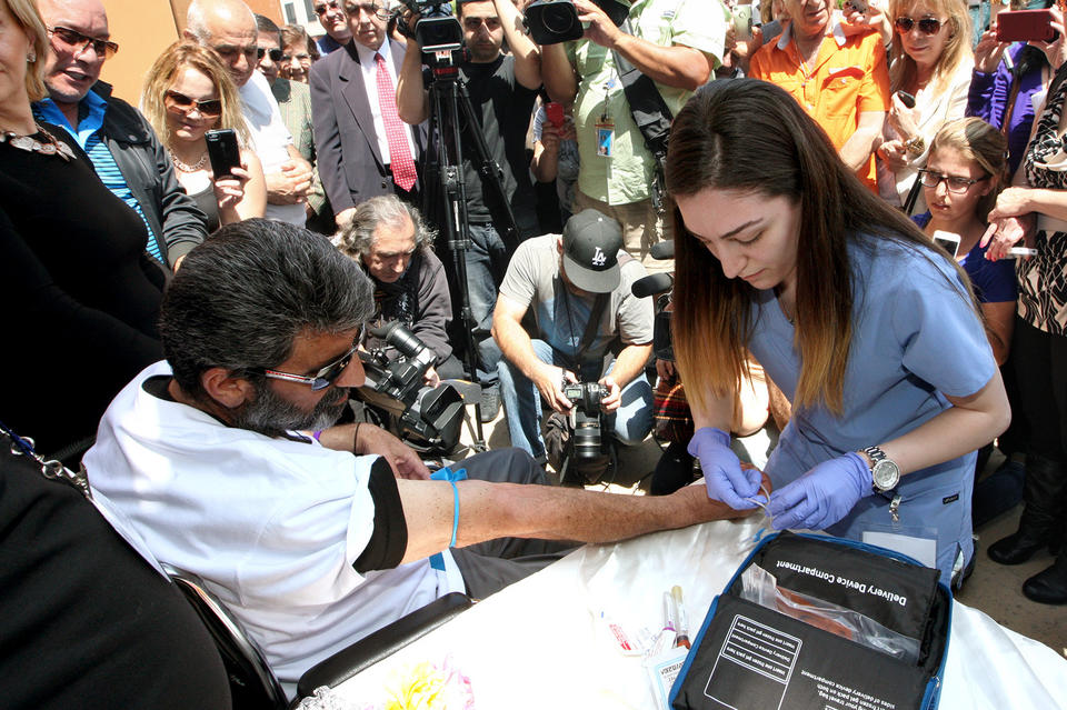 <p>Agasi Vartanyan has his vitals checked after emerging from a glass enclosure at St. Leon Cathedral in Burbank on Thursday, May 28, 2015, where he fasted for 55 days to commemorate the 100th anniversary of the Armenian Genocide.</p>