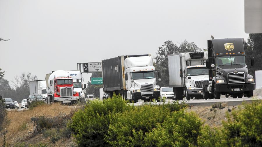 Trucks and soot on freeways.