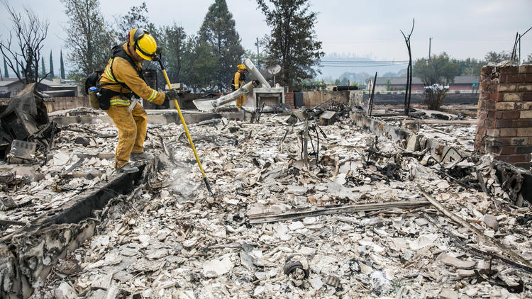 Firefighters look for hotspots on Monday after the Valley fire destroyed homes in Middletown, Calif. (Marcus Yam / Los Angeles times)