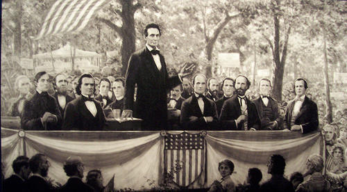 Abraham Lincoln, standing, and Stephen Douglas, sitting to Lincoln's right, staged the most elevated debates in U.S. history ... or did they?