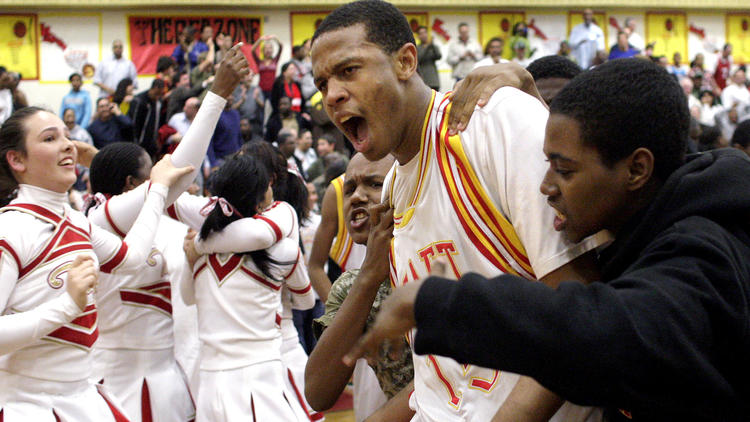 Taft High's Bryce Dejean-Jones celebrates after making a game-winning three-point shot at the buzzer against Leuzinger in a state playoff game.