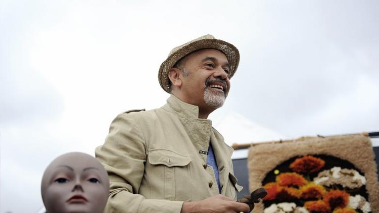 Christian Louboutin likes to wear a shopping uniform, which includes a safari jacket, for his flea market trips.