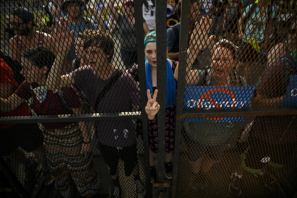 Protesters shout at delegates walking behind the barrier outside the 2016 Democratic National Convention. (Marcus Yam / Los Angeles Times)
