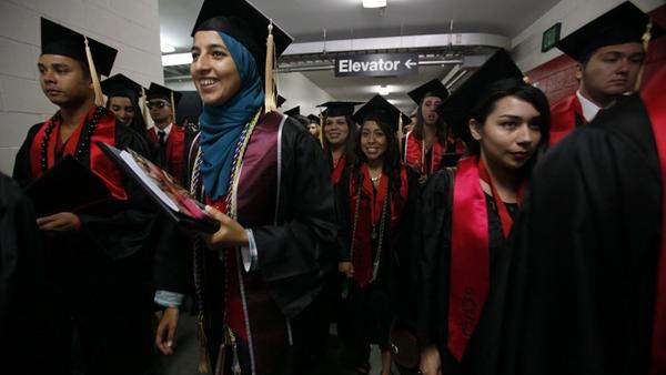 Thousands of students said farewell to San Diego State University Friday, with three separate graduation ceremonies filing through Viejas Arena.
