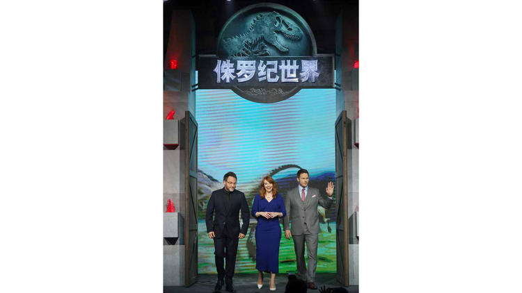 From left, "Jurassic World" director Colin Trevorrow, actress Bryce Dallas Howard and actor Chris Pratt attend a news conference at Yintai Centre on May 26, 2015, in Beijing.
