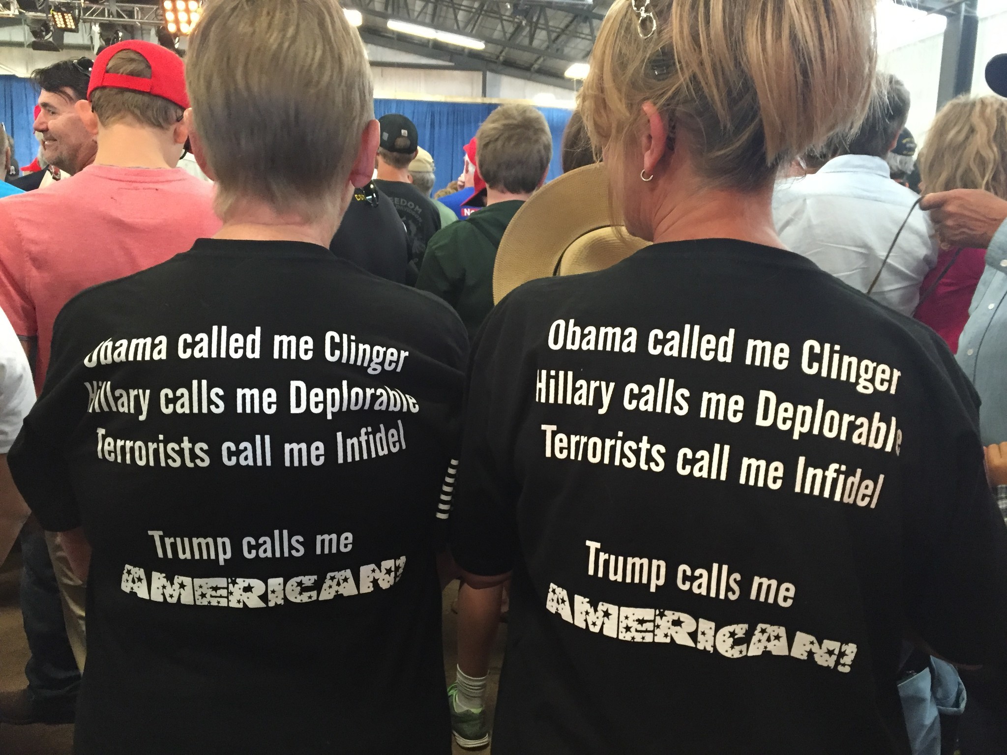 Neighbors Kathy Smith and Tina Griffiths wear matching Trump T-shirts at a rally in Colorado.