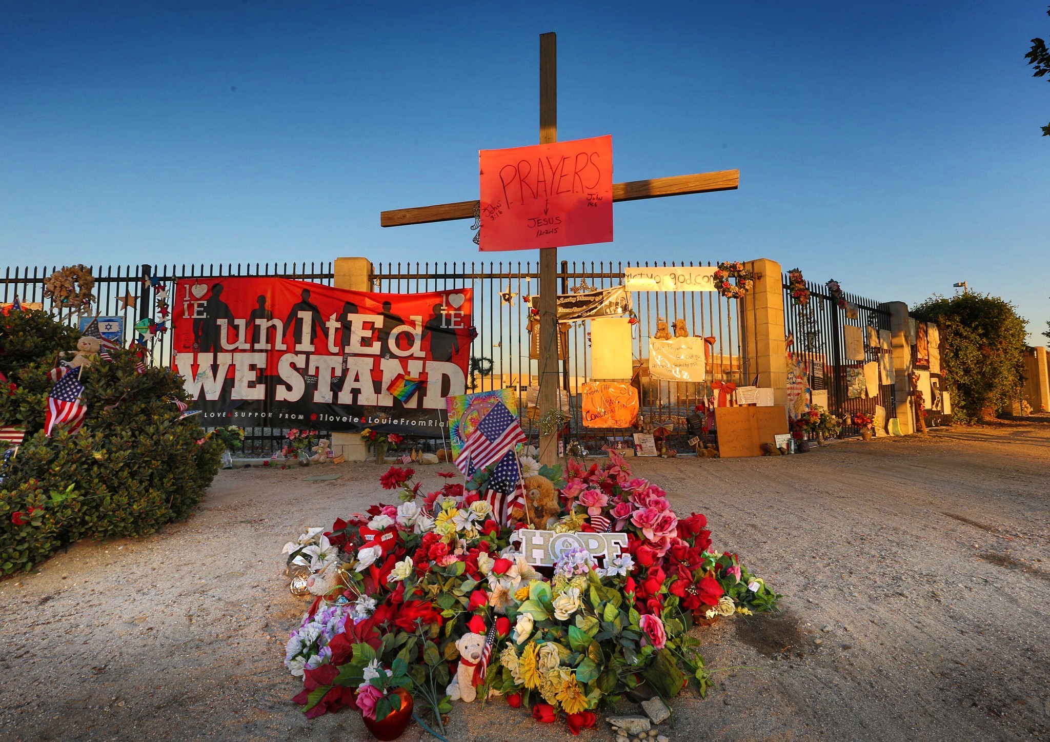 Near the Inland Regional Center in San Bernardino, Calif., flowers and signs still honor the 14 people killed in a mass shooting there in 2015.