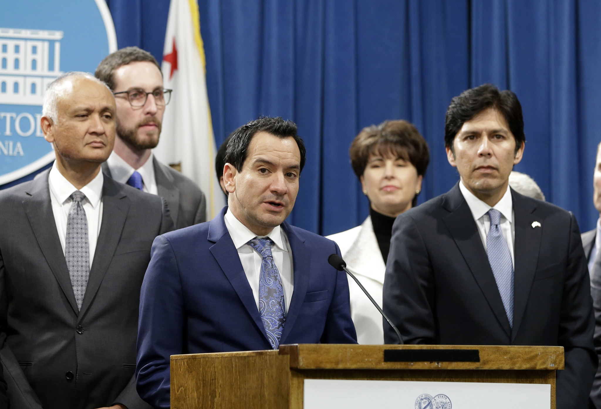 California Assembly Speaker Anthony Rendon, D-Paramount, third from left, flanked by Senate President Pro Tem Kevin de Len, D-Los Angeles, right, and other Democratic lawmakers, discusses a pair of proposed measures to protect immigrants, during a news conference in Sacramento.