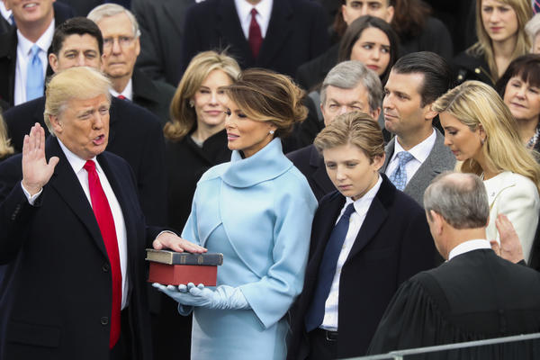 Trump is sworn in as president, a divisive, singular figure promising to lift up 'the forgotten'