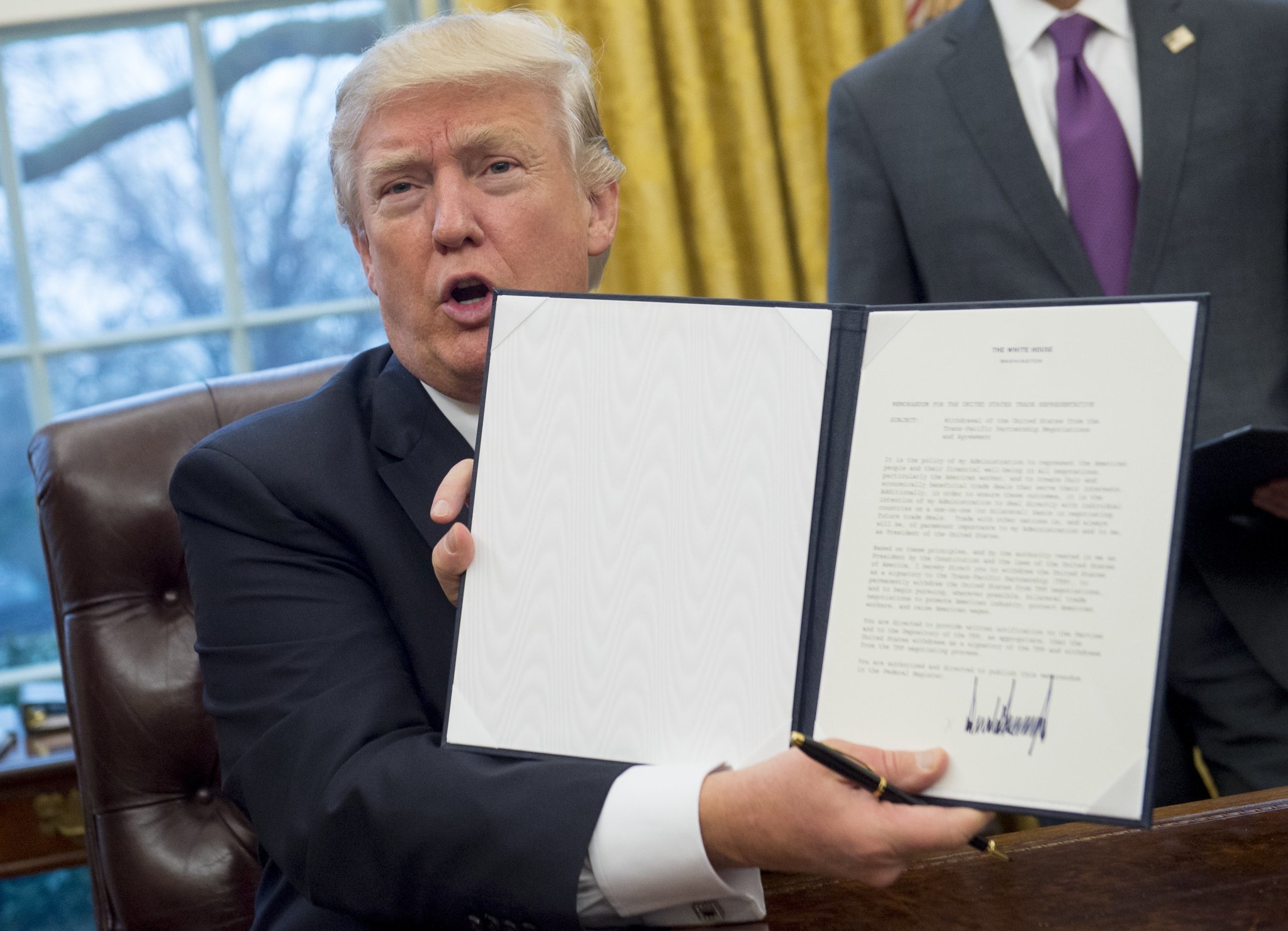 President Trump signs orders on hiring freeze, TPP exit, global abortion policy