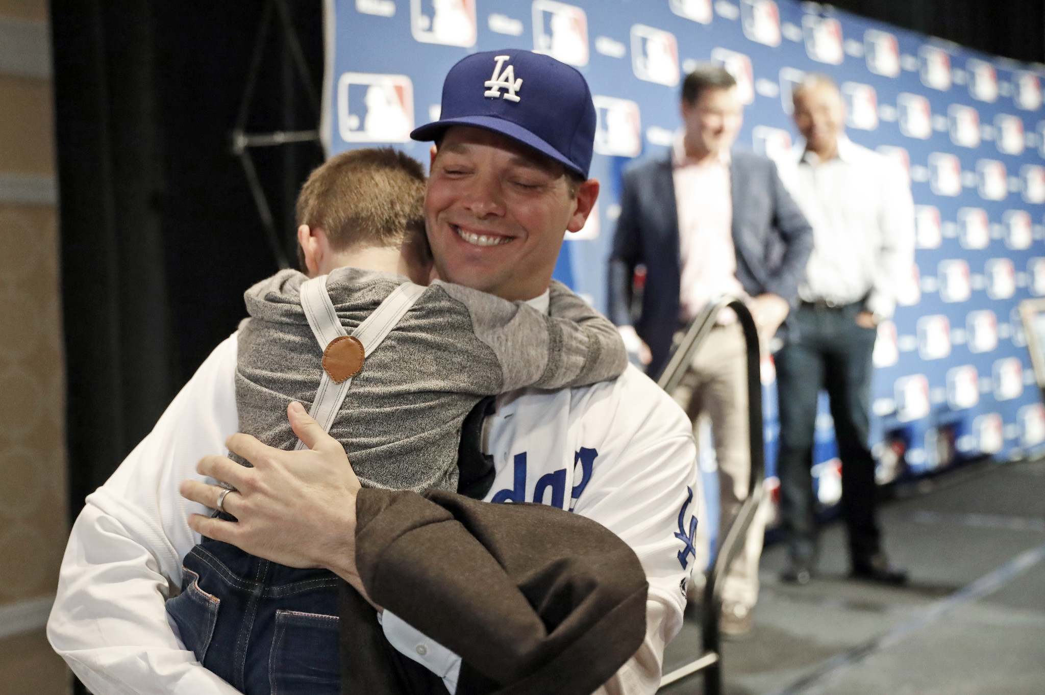 Rich Hill hugs his son Brice, 5, after the pitcher's new three-year deal with the Dodgers was announced at Major League Baseball's winter meetings on Dec. 5.