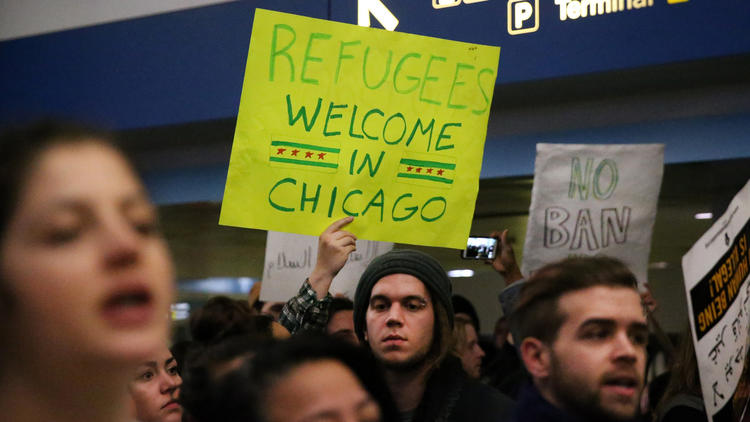 Protesters gather at O'Hare airport after travelers held