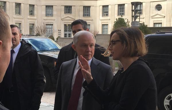 Jeff Sessions speaks to Sarah Isgur Flores, the spokeswoman for his confirmation, as he arrives at the Justice Department for the first time as attorney general on Feb. 9. (Del Quentin Wilber)