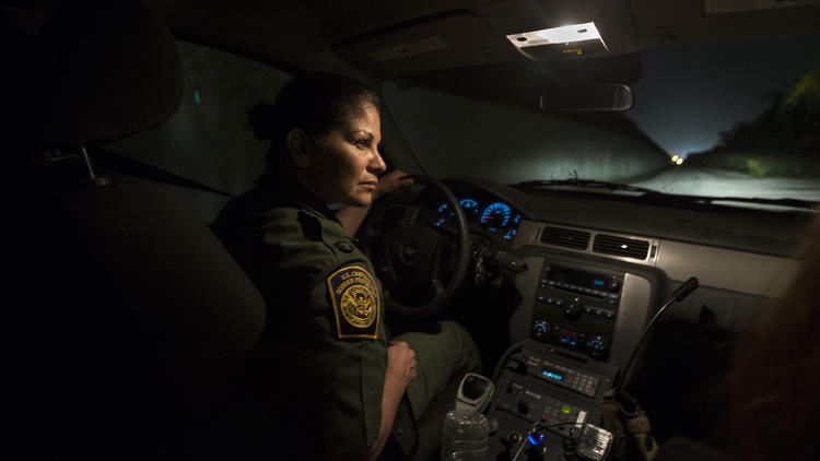 U.S. Border Patrol Agent Marlene Castro keeps an eye out for drug smugglers and migrants illegally c