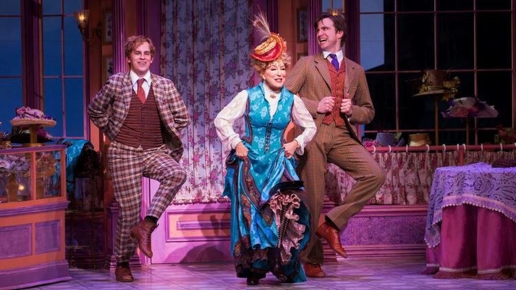 Midler flanked by Taylor Trensch, left, and Gavin Creel.